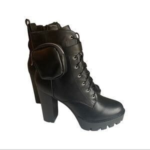 Black combat boots with mini coin